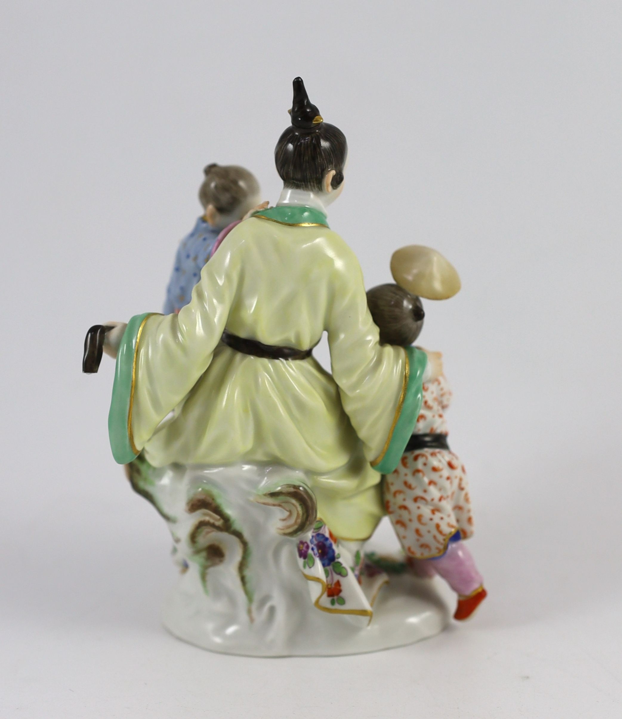 A Meissen group of a Chinese woman and two children, 20th century, 14.5 cm high